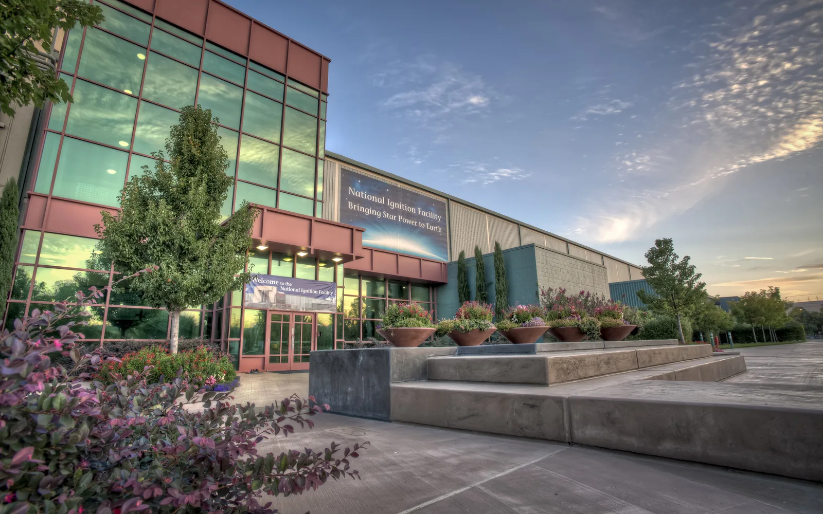 Exterior view of the National Ignition Facility at sunset, a ten-story building at Lawrence Livermore National Laboratory